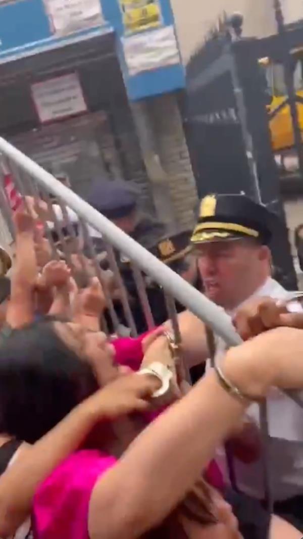 New York City Councilwoman Susan Zhuang clashing with NYPD officers at a demo<em></em>nstration against homeless shelters in Bensonhurst, Brooklyn.