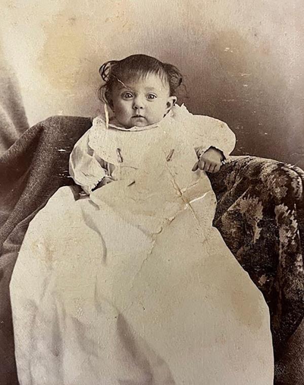 A baby in what appears to be a Christening gown is one of the oldest looking 
photos in the batch of rescued artifacts.