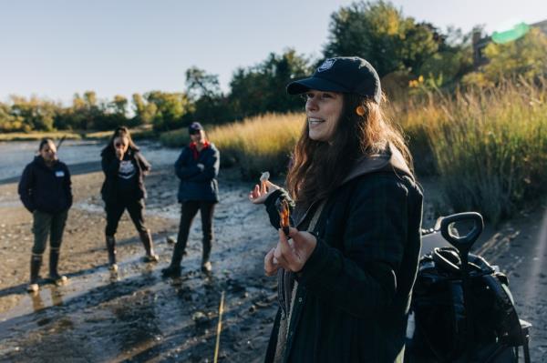 Cody Herrmann, right, demo<em></em>nstrates how to identify oysters and clams at Powell's Cove Park in Queens